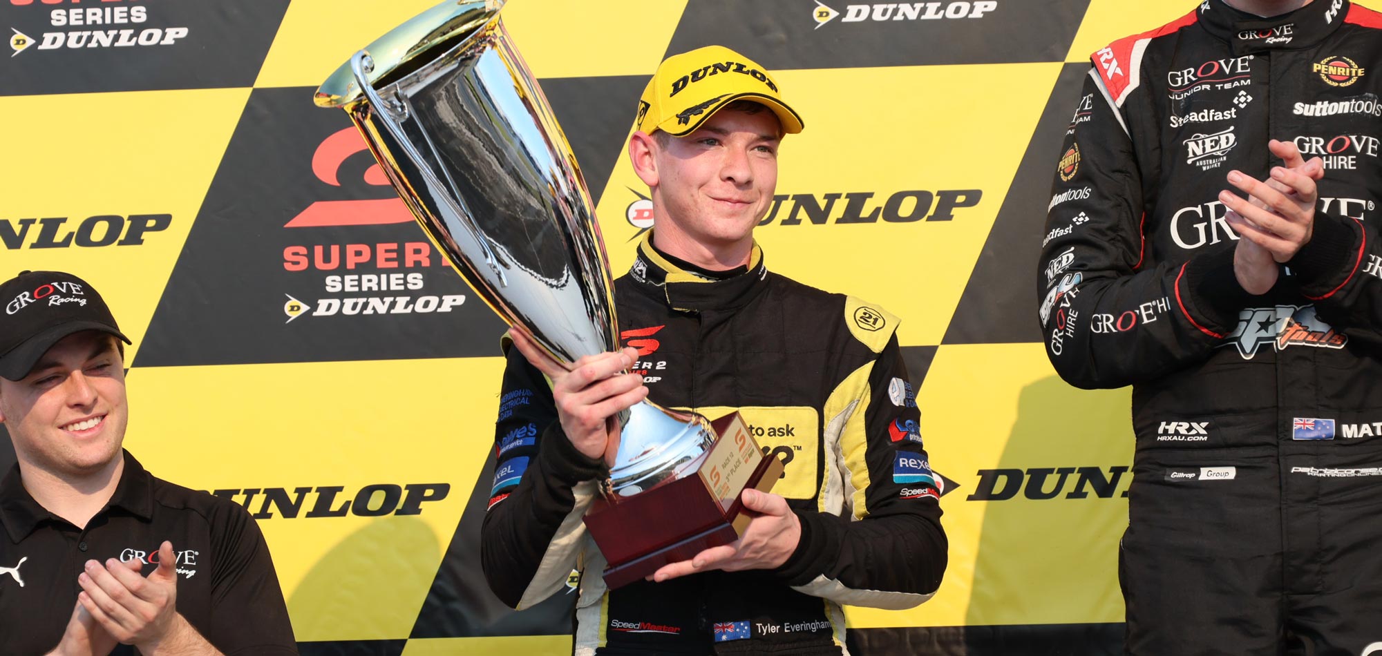 racing driver with trophy